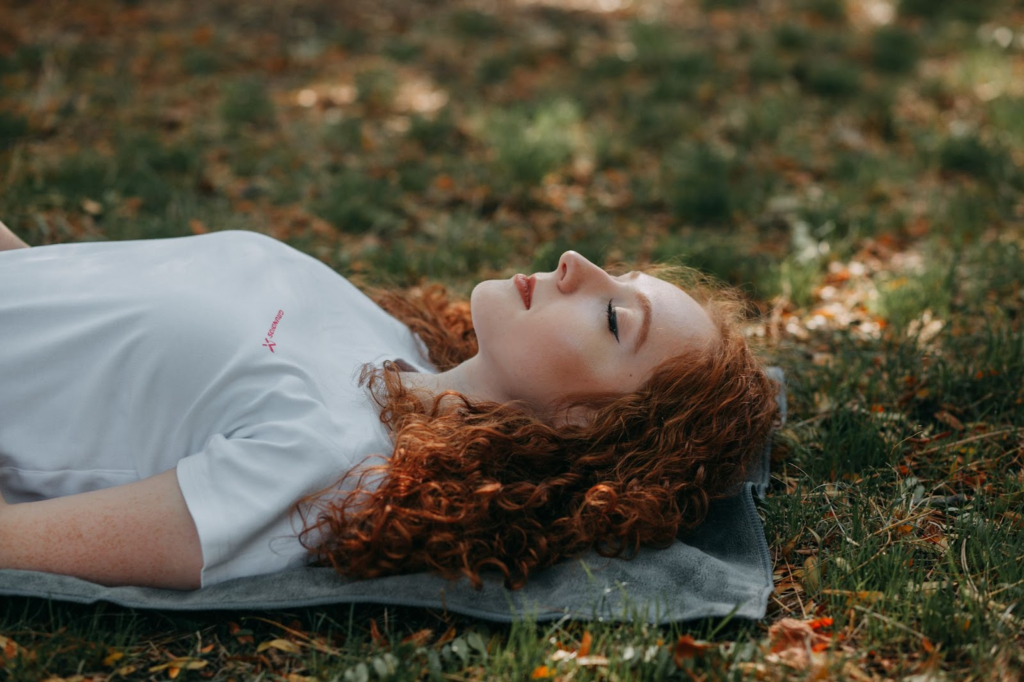 A Girl lying down for Body Scan Meditation featured on Mastering Mindfulness Techniques for Stress Reduction and Mental Well-being in Healthy and Better Living