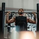Person doing bench press featured in the Master the Bench Press with 10 Proven Techniques in healthy and better living