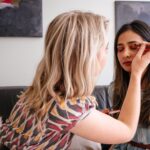 Girl doing Makeup for Enhancing Natural Features in article by the Healthy and Better Living