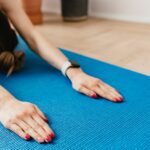 a girl doing a Yoga pose featured in the article - on the 5 Best Yoga Poses for Relieving Back Pain - published in healthy and better living