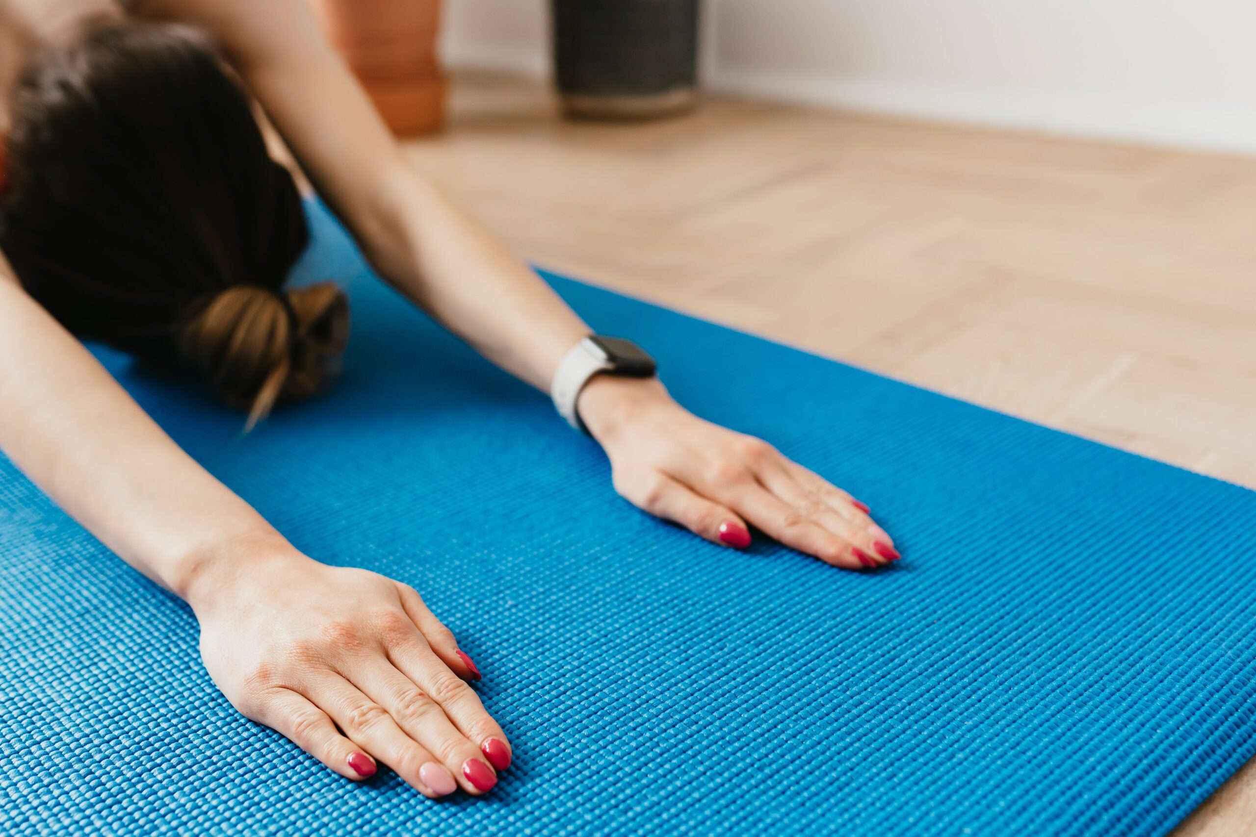 a girl doing a Yoga pose featured in the article - on the 5 Best Yoga Poses for Relieving Back Pain - published in healthy and better living