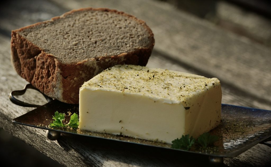 image of butter and bread featured in article on foods to avoid while taking metformin published on healthy and better living
