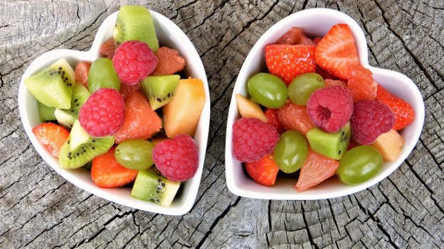 two heart shaped bowls with healthy fruits featured on Unlocking Heart Health: Lifestyle Changes for a Strong Cardiovascular System on healthy and better living