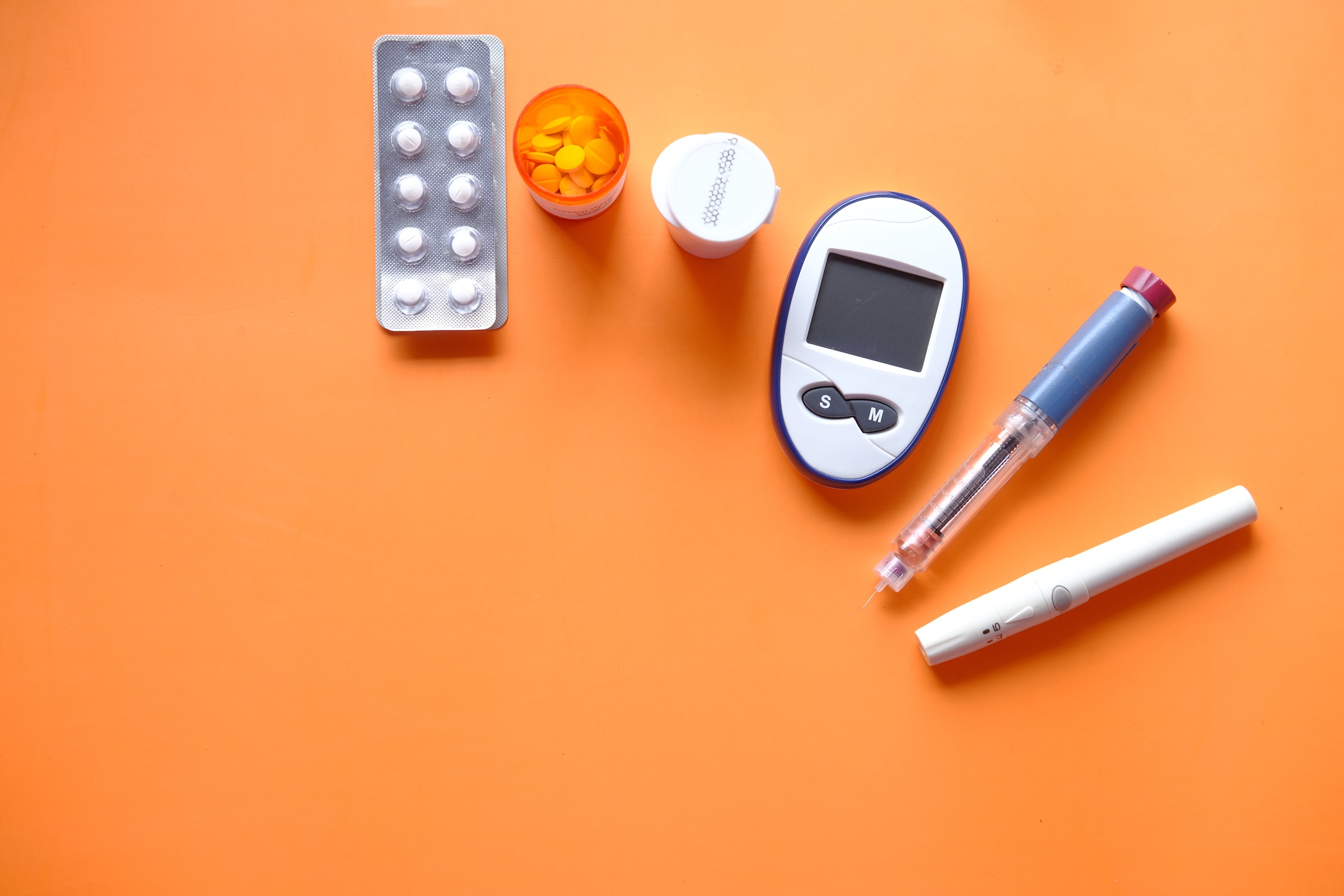 featured image of diabetic medication and meter for article on foods to avoid while taking metformin - published on healthy and better living